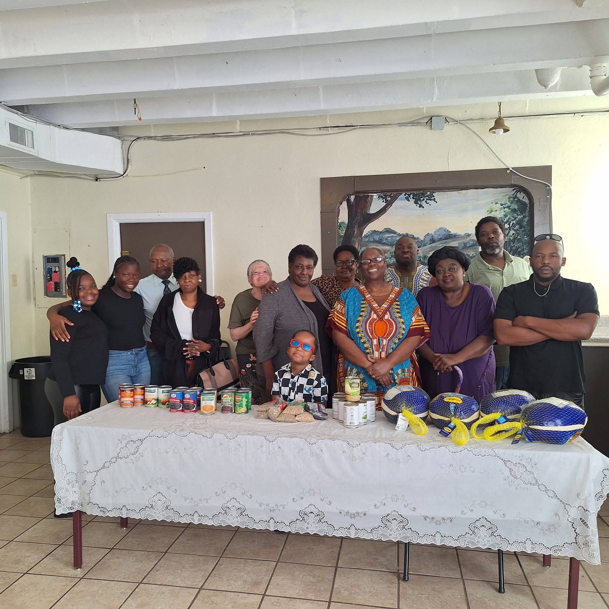 Smith Metropolitan members gathered with food for neighbors